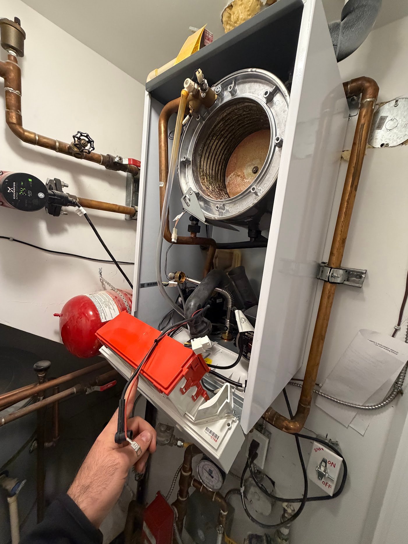 Open boiler heat exchanger inspection during boiler service in Port Moody