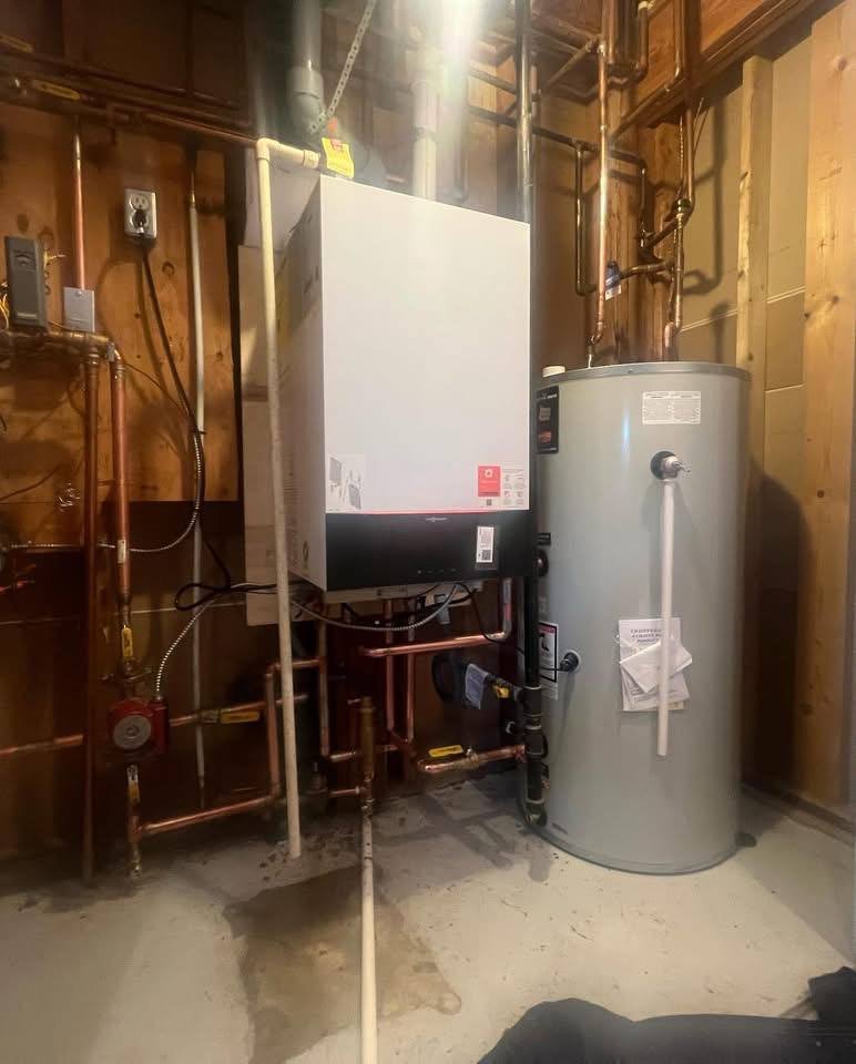 Viessmann Boiler Installation After Completion Completed Viessmann wall-hung boiler installation beside a hot water storage tank
